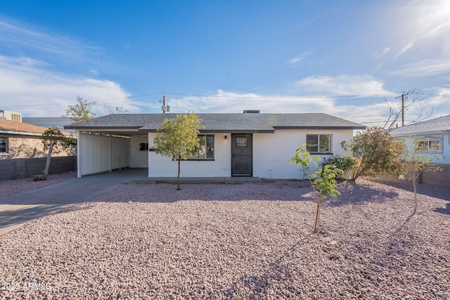 ranch-style house with a carport