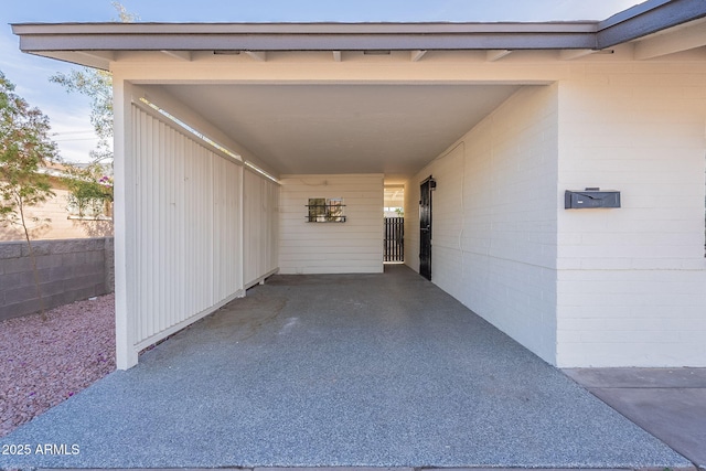 doorway to property featuring a carport