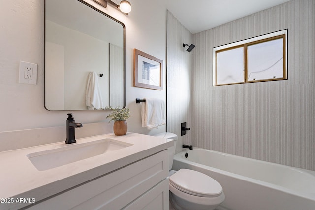 full bathroom featuring vanity, toilet, and tiled shower / bath