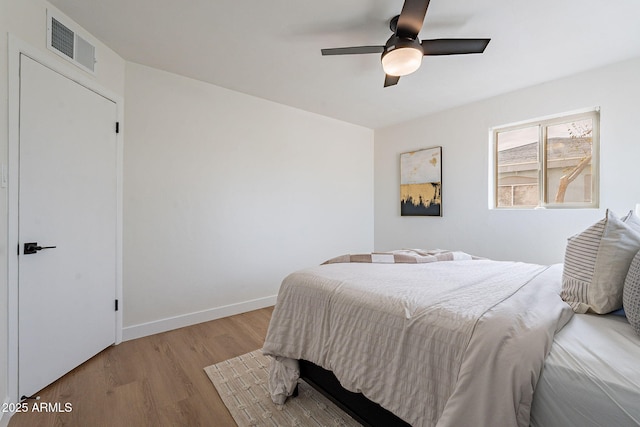 bedroom featuring ceiling fan and light hardwood / wood-style floors