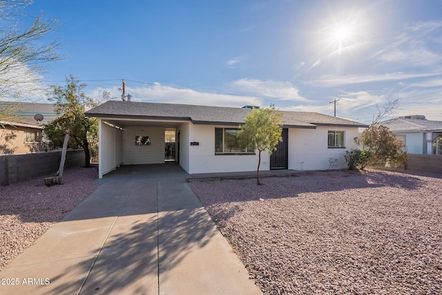 single story home featuring a carport