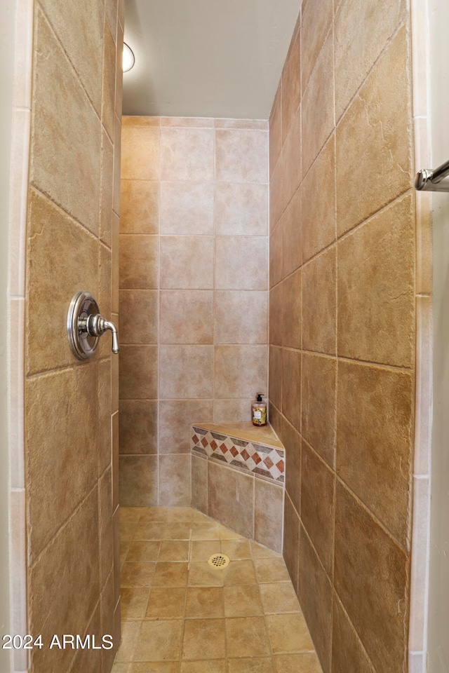 bathroom with a tile shower