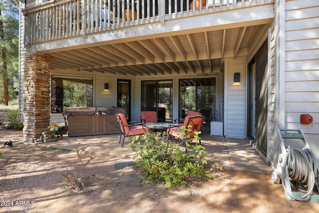 view of patio with a hot tub