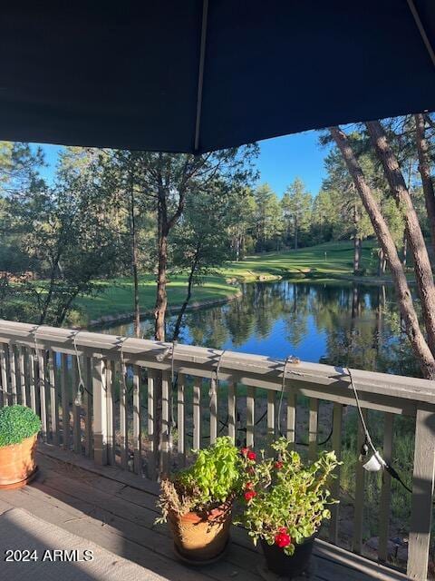 wooden deck featuring a water view