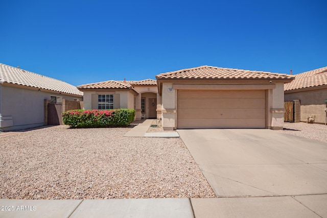 764 E Shannon St, Chandler, AZ 85225 - mediterranean / spanish-style house featuring a garage, a tile roof, stucco siding, driveway, and a gate