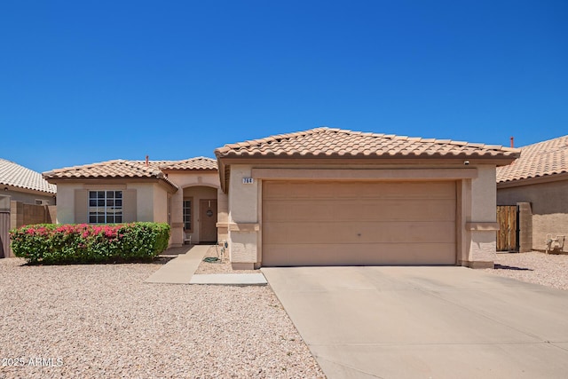 764 E Shannon St, Chandler, AZ 85225 - mediterranean / spanish home featuring stucco siding, concrete driveway, an attached garage, and a tile roof