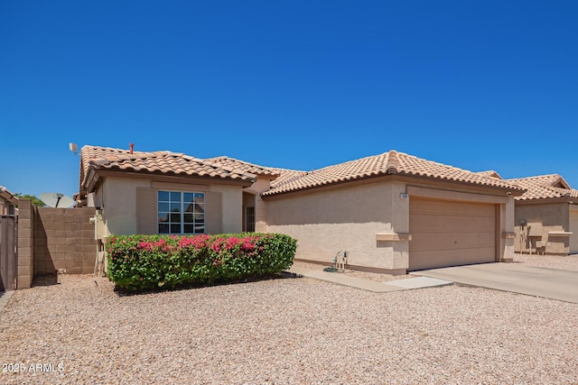 764 E Shannon St, Chandler, AZ 85225 - mediterranean / spanish home featuring a garage, stucco siding, driveway, and a tile roof
