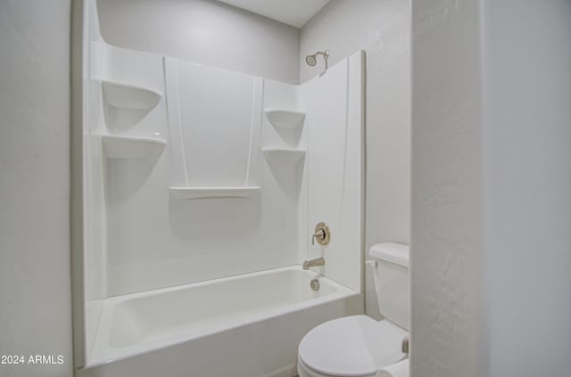 full bathroom featuring tub / shower combination and toilet