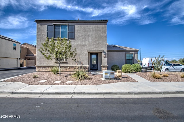 view of front facade featuring stucco siding