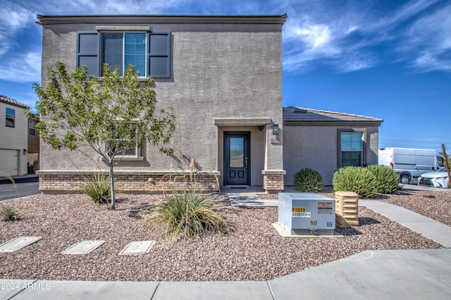 view of front of house featuring stucco siding