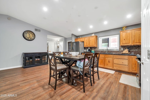 37508 N 12th St, Phoenix, AZ 85086 - dining area with lofted ceiling, light wood-style flooring, recessed lighting, and baseboards