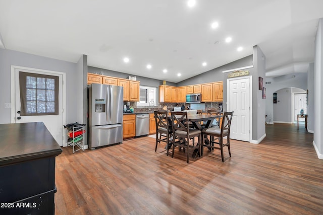 37508 N 12th St, Phoenix, AZ 85086 - dining area with arched walkways, wood finished floors, baseboards, vaulted ceiling, and recessed lighting
