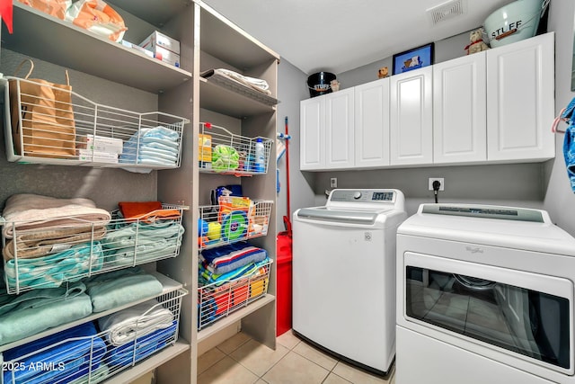 37508 N 12th St, Phoenix, AZ 85086 - washroom with washer and dryer, cabinet space, and light tile patterned floors