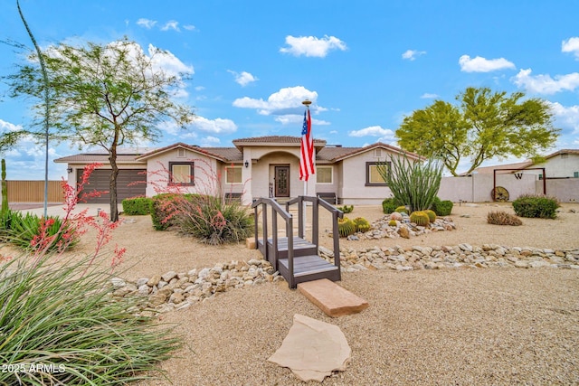 37508 N 12th St, Phoenix, AZ 85086 - view of front of home featuring stucco siding, an attached garage, fence, and driveway