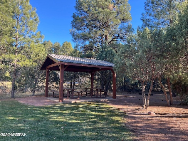 surrounding community featuring a gazebo and a yard