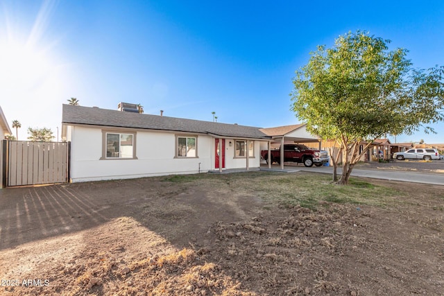 ranch-style home with a carport