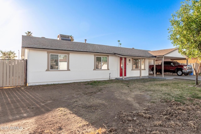 ranch-style home with a carport