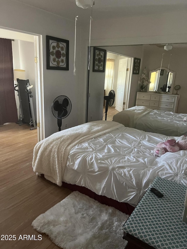 bedroom featuring wood finished floors