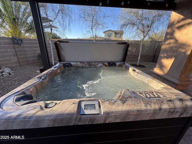 exterior details featuring a hot tub