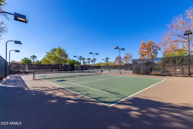 view of tennis court with basketball court