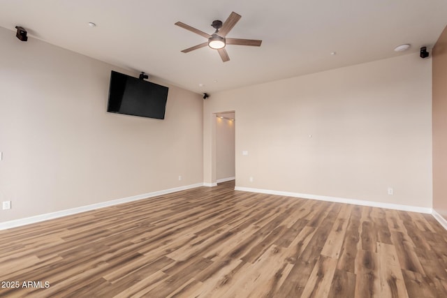 unfurnished room featuring light hardwood / wood-style floors and ceiling fan