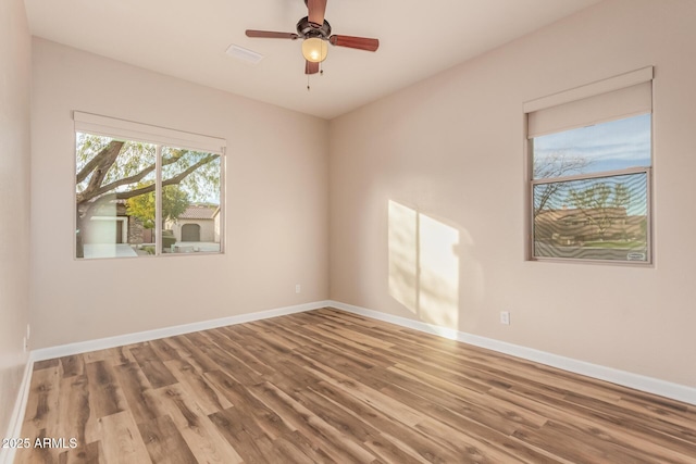 unfurnished room with wood-type flooring and ceiling fan