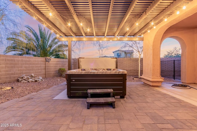 view of patio terrace at dusk