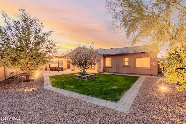 exterior space with a patio area and a lawn