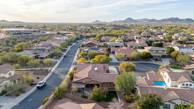 birds eye view of property with a mountain view