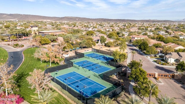 birds eye view of property with a mountain view