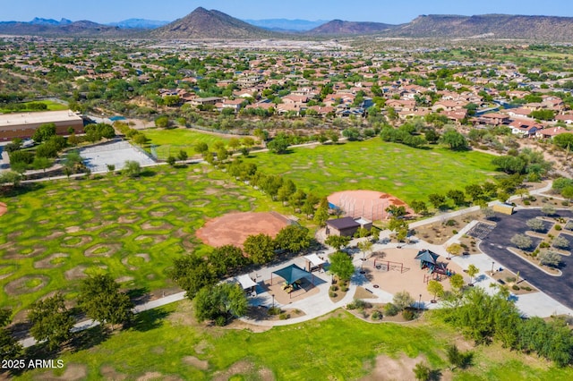 birds eye view of property featuring a mountain view