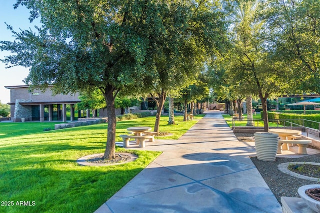 view of home's community with a yard