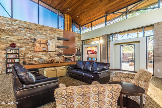 living room with high vaulted ceiling, carpet, and wooden ceiling