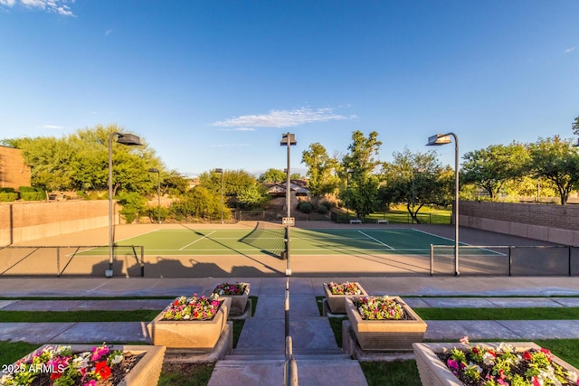 view of sport court featuring tennis court