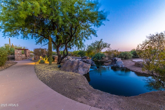 view of pool at dusk