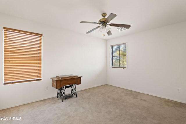 carpeted empty room with ceiling fan