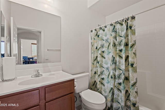 full bathroom with vanity, toilet, and shower / bath combo with shower curtain