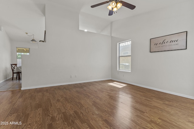 10727 E El Moro Ave, Mesa, AZ 85208 - empty room featuring lofted ceiling, ceiling fan, and wood finished floors