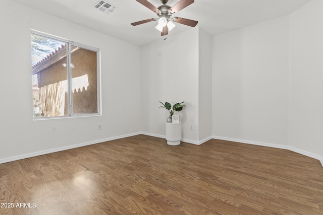 10727 E El Moro Ave, Mesa, AZ 85208 - spare room with wood finished floors and ceiling fan