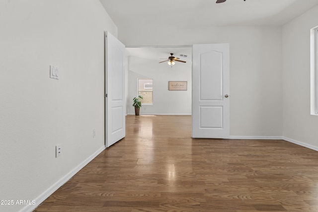 10727 E El Moro Ave, Mesa, AZ 85208 - unfurnished room featuring a ceiling fan and wood finished floors