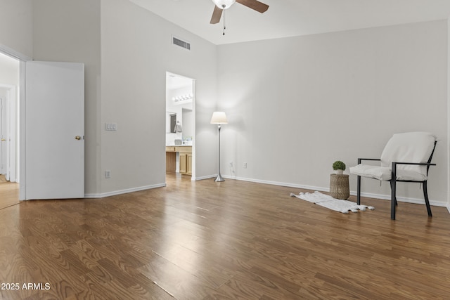 10727 E El Moro Ave, Mesa, AZ 85208 - unfurnished room with a ceiling fan, a high ceiling, and wood finished floors