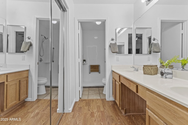 10727 E El Moro Ave, Mesa, AZ 85208 - full bath with double vanity, wood finished floors, and a walk in shower