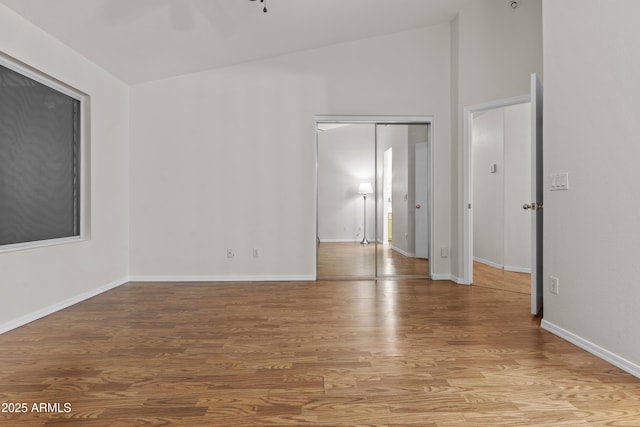 10727 E El Moro Ave, Mesa, AZ 85208 - unfurnished room with light wood-type flooring and vaulted ceiling