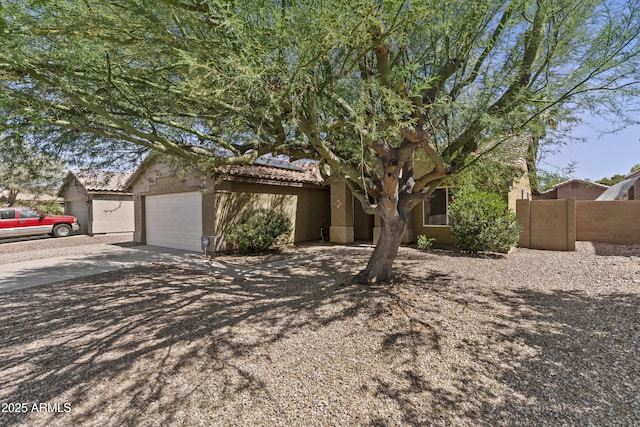10727 E El Moro Ave, Mesa, AZ 85208 - view of front of property featuring solar panels, concrete driveway, stucco siding, a tile roof, and a garage