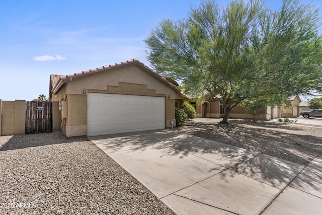 10727 E El Moro Ave, Mesa, AZ 85208 - view of front of home with stucco siding, an attached garage, driveway, a tile roof, and a gate