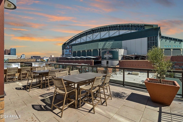 view of patio terrace at dusk