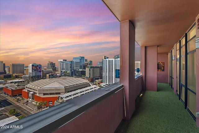 view of balcony at dusk