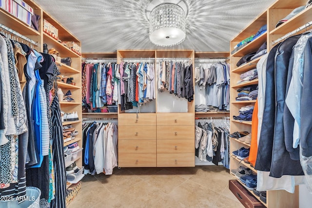 walk in closet featuring tile patterned flooring