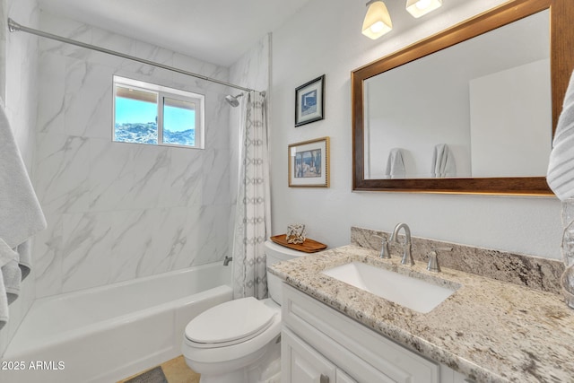 bathroom with toilet, shower / bathing tub combination, and vanity