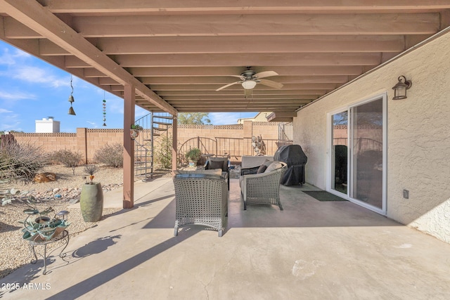 view of patio with a ceiling fan, a fenced backyard, grilling area, and stairs